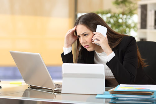 Person on phone with troubled look on face