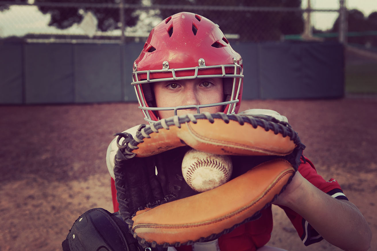 Boy holds the ball in his hand