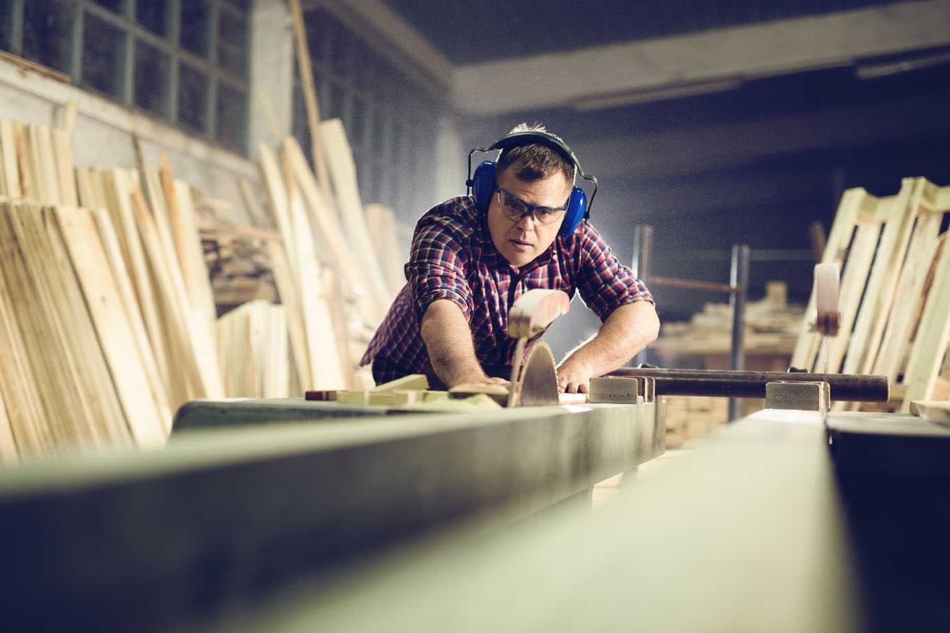 Man cutting wood with a circular saw