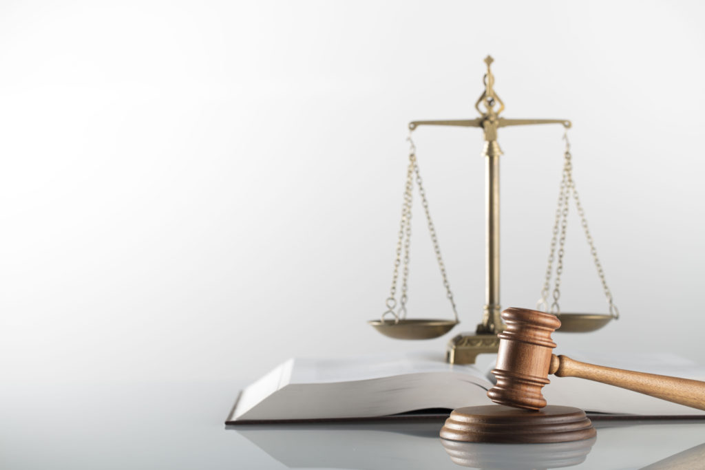 Court mallet on table with book